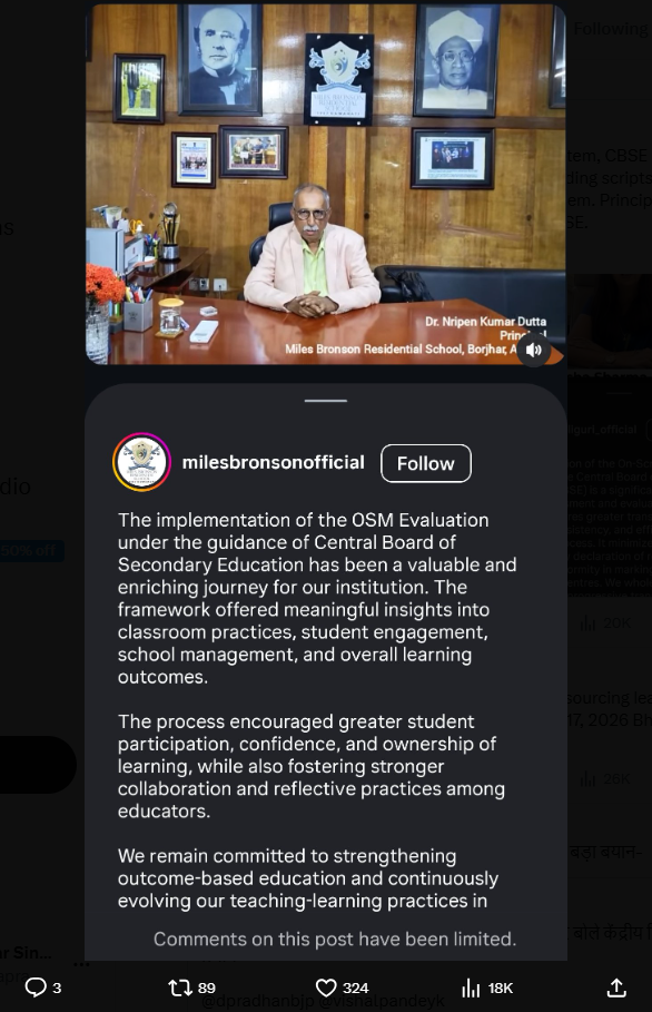 Screenshot 290 | No. 1 Indian Media News Portal Head-and-shoulders of a man in a pink blazer seated at a large wooden desk in a wood-paneled office, framed portraits on the wall behind him.