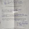 A scanned Hindi form filled with blue ink: names, dates, and a signature on the bottom line.