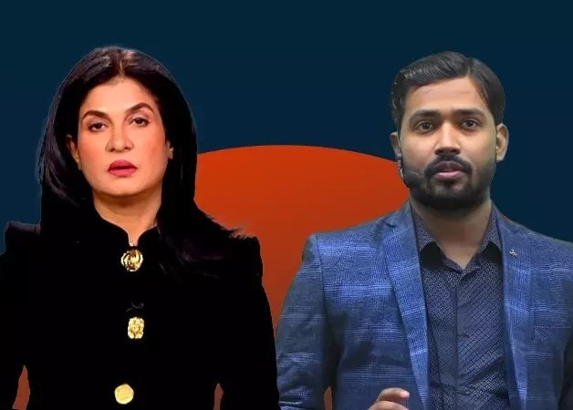 Two news hosts standing side by side against a dark blue backdrop with an orange semicircle behind them, the woman in black with gold buttons and the man in a blue blazer.