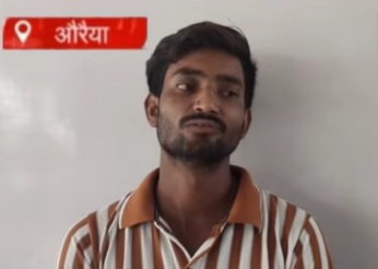 Man with a striped brown-and-white shirt speaking, with a red Hindi news banner in the top-left reading 'Auraiya'