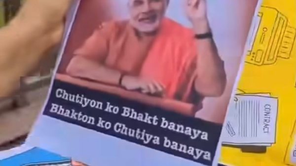 Poster depicting a man in orange robes, gesturing with a raised finger; text at top reads 'Mere achievements' and bottom caption says 'Chutiyon ko Bhakt banaya Bhakt ko Chutiy a banaya' (criticizing followers).