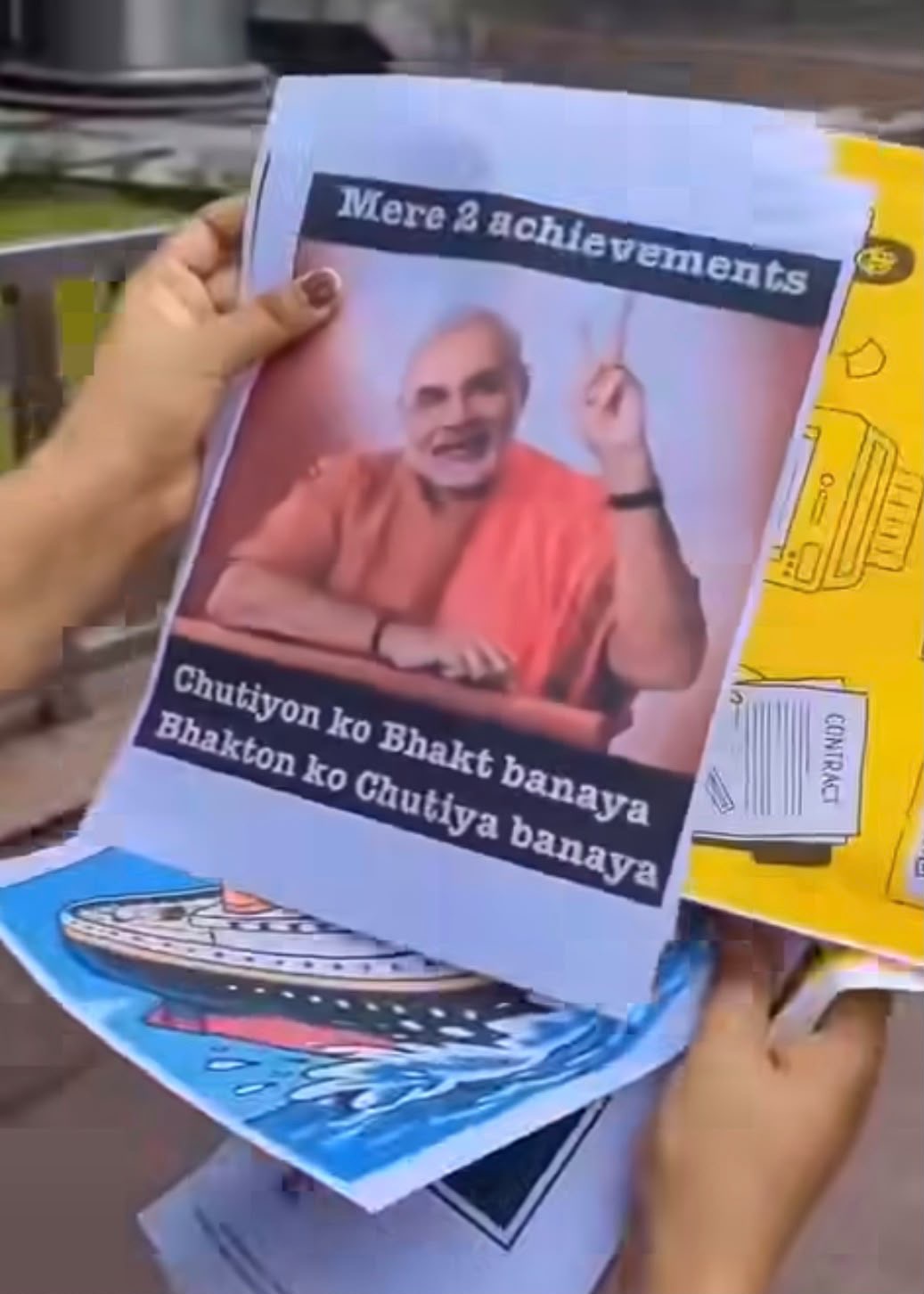 Poster depicting a man in orange robes, gesturing with a raised finger; text at top reads 'Mere achievements' and bottom caption says 'Chutiyon ko Bhakt banaya Bhakt ko Chutiy a banaya' (criticizing followers).