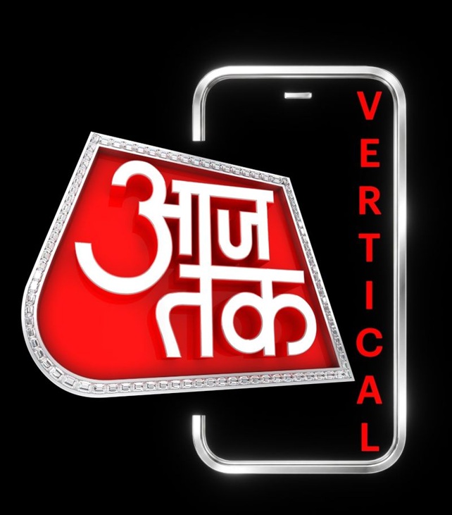 Logo for Aaj Tak news channel featuring a red diamond-shaped badge with white Hindi text on a black background and 'Vertical' written vertically on the right.