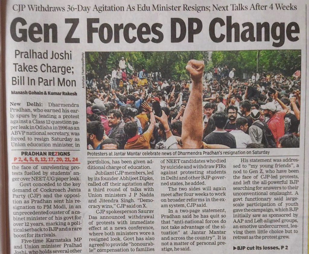 Newspaper front page with bold headline 'Gen Z Forces DP Change' and a large crowd raising fists in a park or public space as the article image