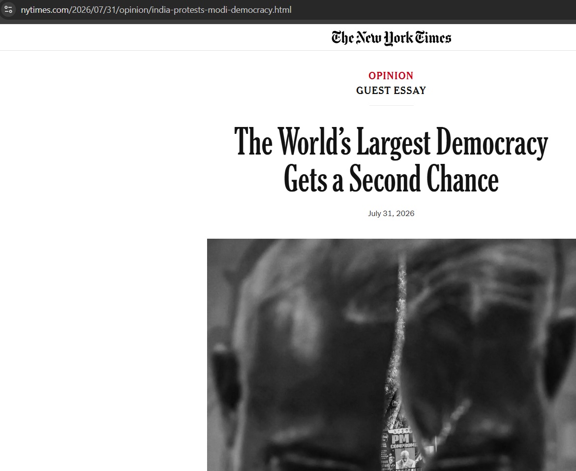 Grayscale close-up of a person’s back/head with a badge in focus, accompanying the NYT opinion piece titled 'The World's Largest Democracy Gets a Second Chance'.