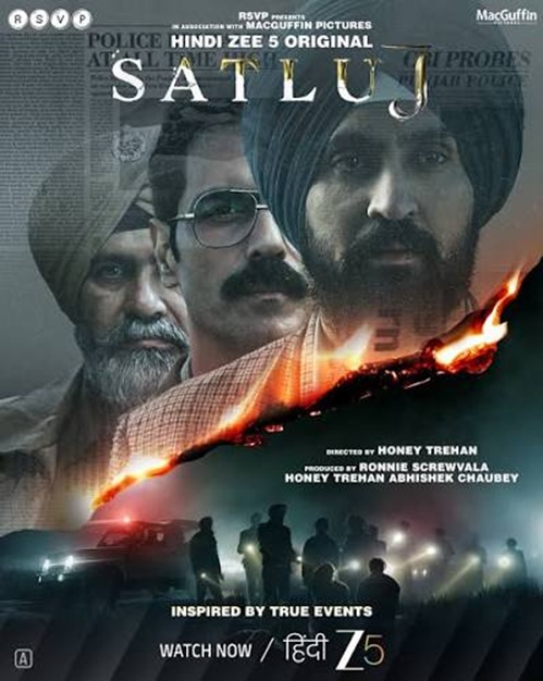 Poster for the Hindi film 'Satluj' featuring three male leads, a blazing fire across the middle, and silhouettes of people and cars at the bottom.