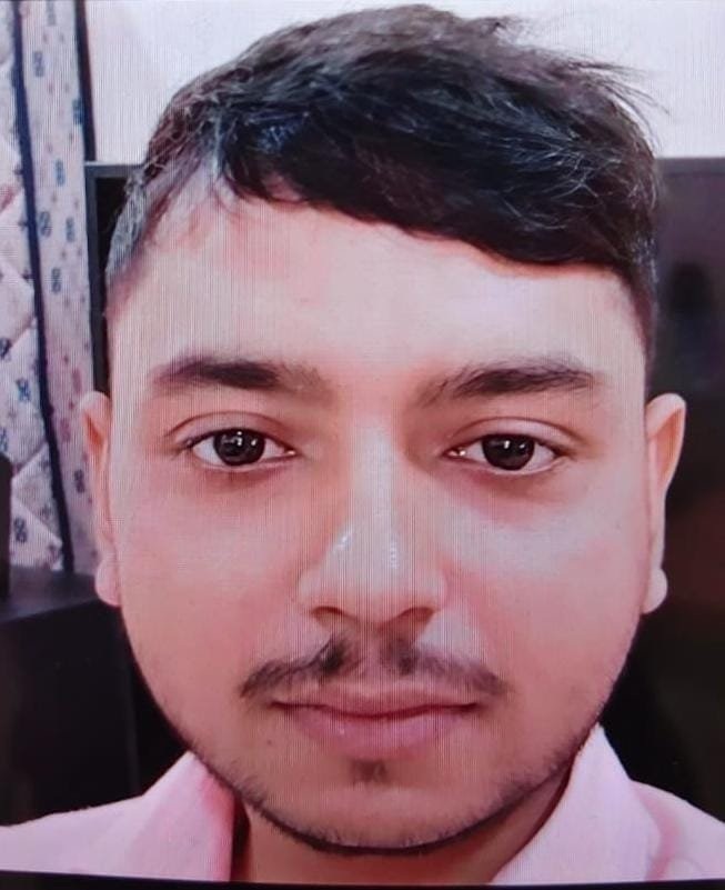 shailendra | No. 1 Indian Media News Portal Close-up portrait of a man with short dark hair and light stubble, wearing a pale pink shirt, looking at the camera.