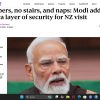 Close-up portrait of Narendra Modi, Indian prime minister, with white beard and glasses, accompanying a news article headline about his security during a NZ visit.