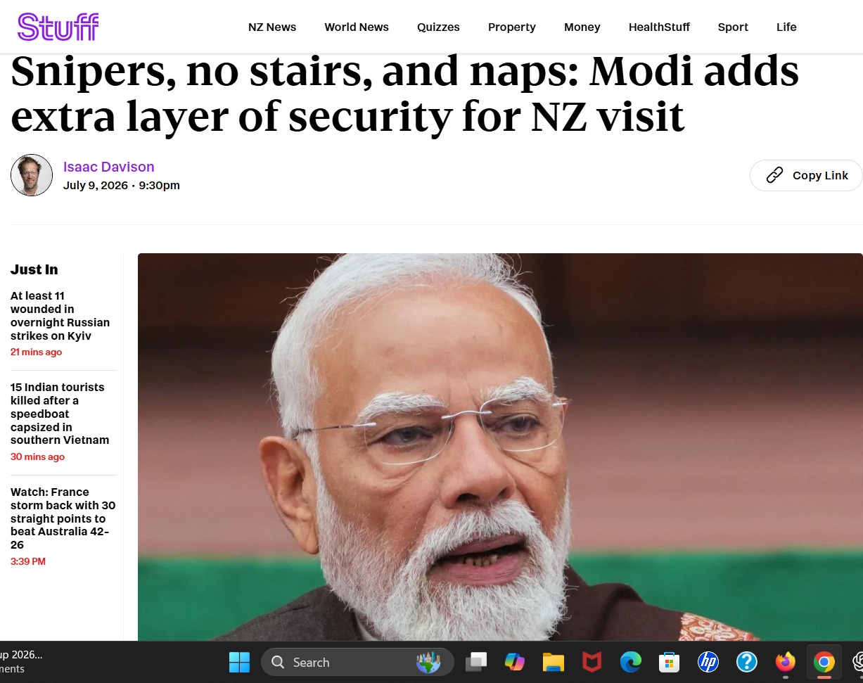 Close-up portrait of Narendra Modi, Indian prime minister, with white beard and glasses, accompanying a news article headline about his security during a NZ visit.