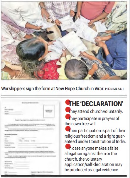 Worshippers gathered around a table, signing forms at New Hope Church in Virar.
