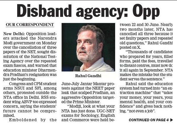 Newspaper front page with the headline 'Disband agency: Opp' and a photo of Rahul Gandhi beside the article text.