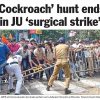 Crowd of protesters pushes against metal barricades as a police officer in khaki maintains a line, during a confrontation near Jadavpur University.
