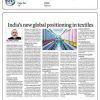 Newspaper article page with the headline 'India’s new global positioning in textiles', showing a portrait photo of a man and a wide photo of a textile mill.
