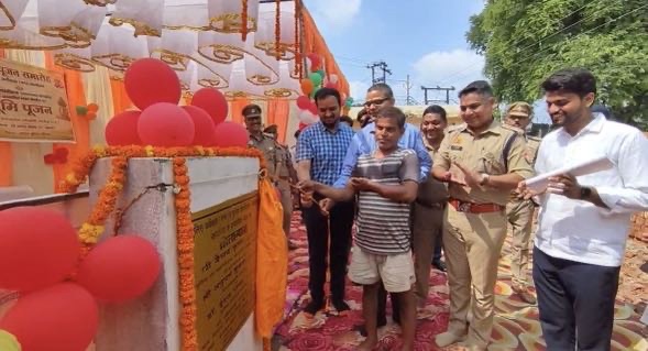 Screenshot | No. 1 Indian Media News Portal Unveiling ceremony at a decorated public project with balloons and marigold garlands; a boy and officials stand before a plaque.
