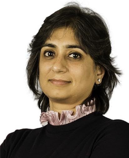 Professional headshot of a woman with short dark hair wearing a black top and pink ruffled collar.
