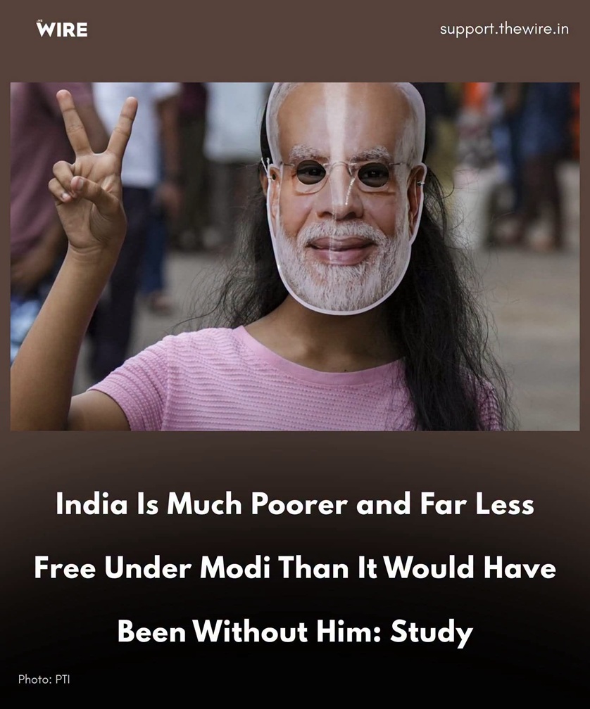 Person wearing a Narendra Modi mask and pink shirt, making a peace sign with fingers; image accompanies a headline about poverty in India.
