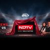 NDTV 24x7 illuminated studio stage with a red-draped screen revealing the NDTV logo and a team of anchors on the right, slogan: 'Today’s News Is About Us'.