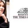 Head-and-shoulders portrait of a woman in a black blouse beside The Times of India Bennett & Coleman emblem on a white background.
