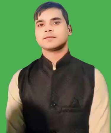 Portrait of a man wearing a black vest over a beige kurta against a solid green background.