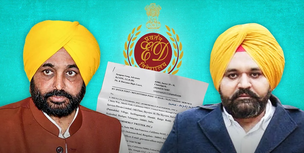 Two men in yellow turbans and beards pose against a teal backdrop, with a white document and an official seal between them.