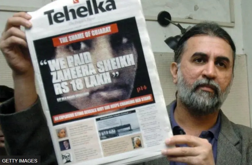 tehlka | No. 1 Indian Media News Portal Man with gray beard holds a Tehelka newspaper showing a large central image and bold headline front page.