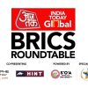 Banner for BRICS Roundtable with India Today Global at top in red, bold 'BRICS ROUNDTABLE' text in black, and co-presenting and partner logos along the bottom (including a university/organization logos and a special partner emblem).