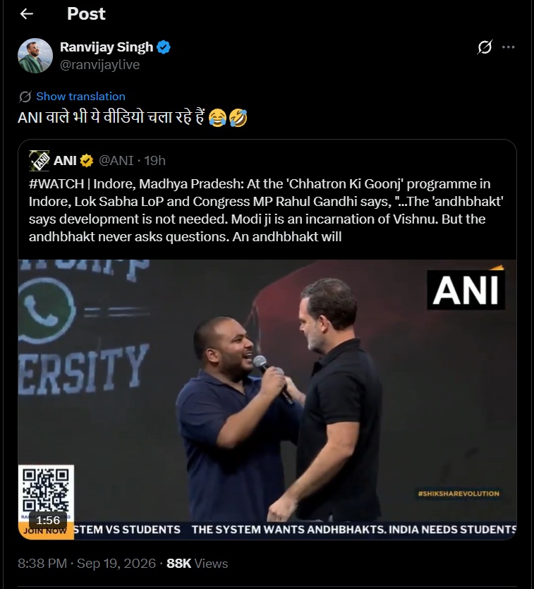 ani_modi | No. 1 Indian Media News Portal Two men on a stage smile at each other, one holding a microphone, during a program; an ANI tweet is shown above the video frame.