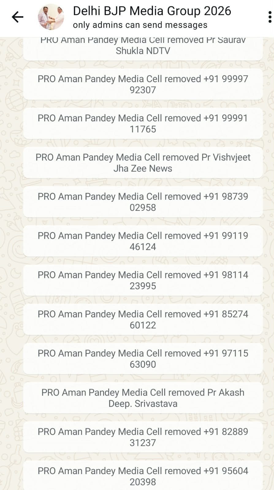 WhatsApp chat screen titled 'Delhi BJP Media Group 2026' showing multiple messages from PRO Aman Pandey Media Cell about removals, each with phone numbers and names, on a patterned background.