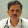Portrait of a male doctor with a stethoscope around his neck, wearing a white coat and looking at the camera.