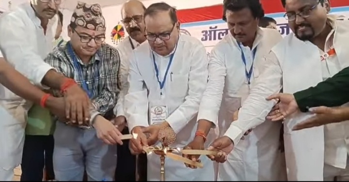 patrakar | No. 1 Indian Media News Portal Group of men in white attire and badges lighting a ceremonial lamp together during an inauguration ceremony.