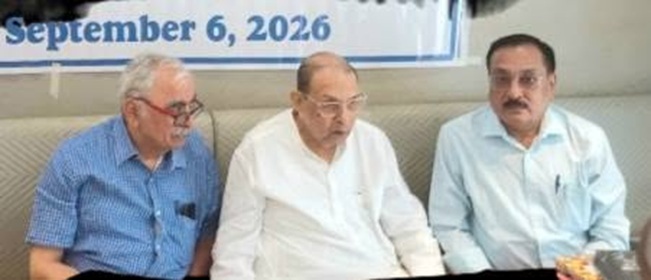 rakesh praveer | No. 1 Indian Media News Portal Three men sitting on a couch at an event, with a banner showing 'September 6, 2026' in the background.