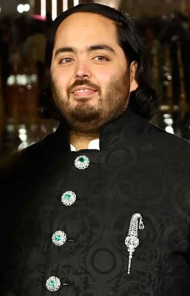Screenshot | No. 1 Indian Media News Portal Portrait of a man in a black, ornate traditional outfit with green emerald-like buttons and a decorative chain.
