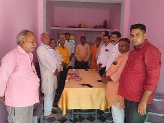 banda | No. 1 Indian Media News Portal Group of men standing around a table in a pink-walled room, with documents spread on the table, appearing to hold a formal meeting