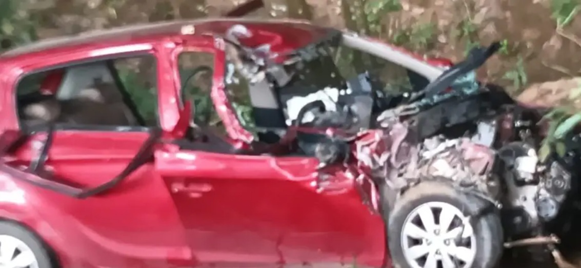 biman dhar | No. 1 Indian Media News Portal Red hatchback severely crushed in a crash, with a smashed front end and debris around it