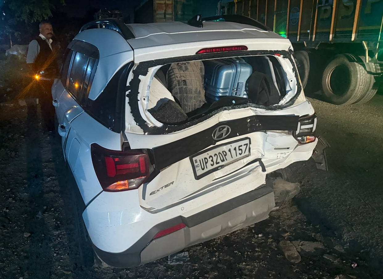 car accident | No. 1 Indian Media News Portal White SUV (Hyundai) with severe rear-end damage and luggage visible in the shattered hatch, at night by a truck on the road.