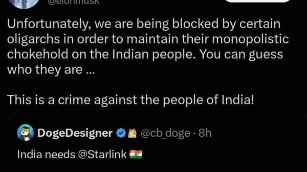 Tweet screenshot: Elon Musk on X claiming oligarchs block the Indian people, with text 'Unfortunately, we are being blocked by certain oligarchs in order to maintain their monopolistic chokehold on the Indian people. You can guess who they are … This is a crime against the people of India!' and a repost from DogeDesigner about India needing Starlink, noting '11,256 of India’s listed villages still lacked 4G coverage as of May 2026.'