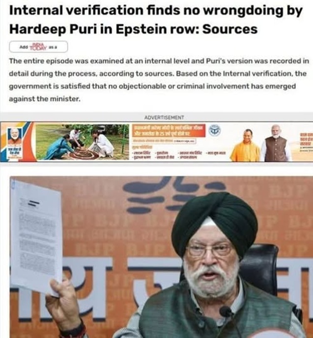 Man wearing a green turban and glasses holds up a document at a press conference.