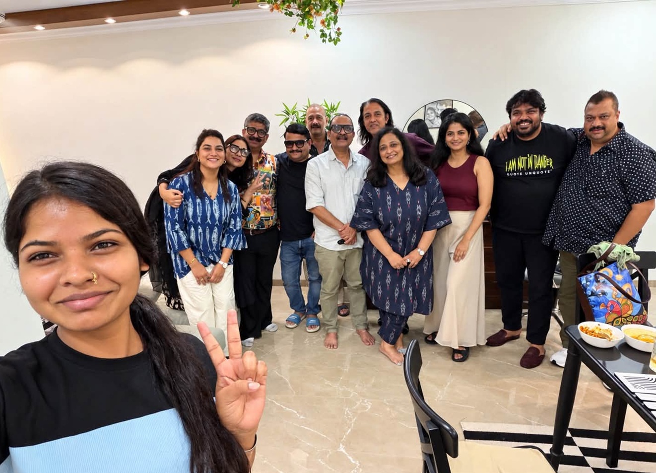 sanjay sharma | No. 1 Indian Media News Portal A group of friends posing together for a selfie indoors, smiling and standing in a casual party setting.