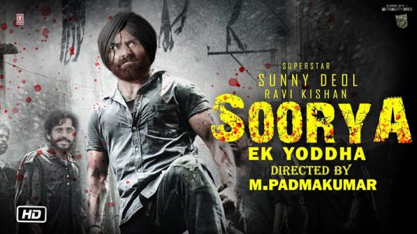 Poster for the film Soorya Ek Yodddha featuring a rugged man with a turban in the foreground, blood splatters, and bold yellow title text on the right.