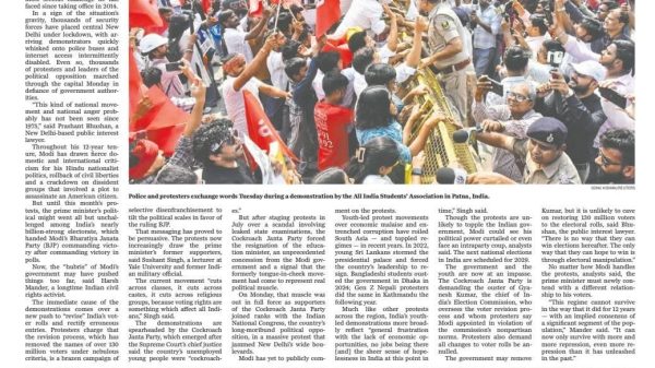 Front page of The World with headline 'India's Modi faces unprecedented challenge to power' and a photo of thousands of protesters clashing with police in Delhi (red flags, crowds, barricades)